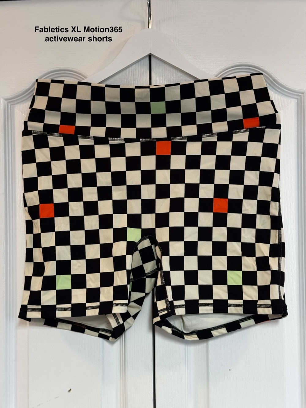 Fabletics Black & White Checkered Motion365 Shorts with Green and Orange Accents